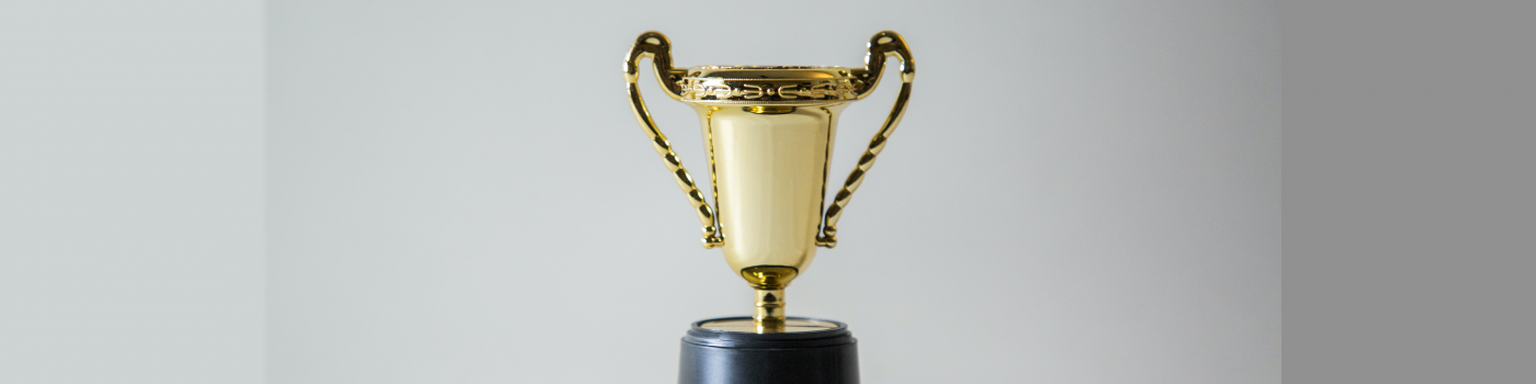 Trophy against plain background.