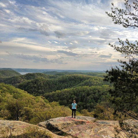 person standing at a vista of the mountains in Morehead