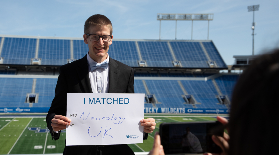 medical student holding up a poster:  "I Matched. Neurology. University of Kentucky"