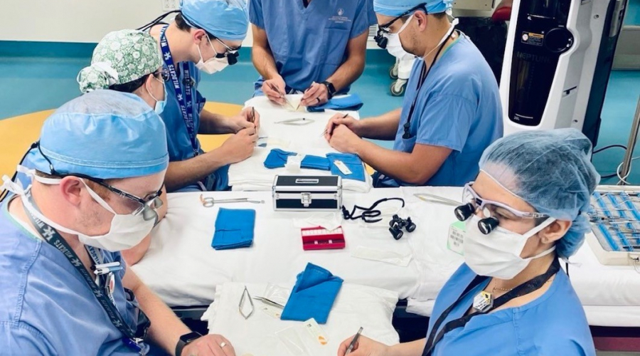 group of ortho residents practicing sutures and stitching