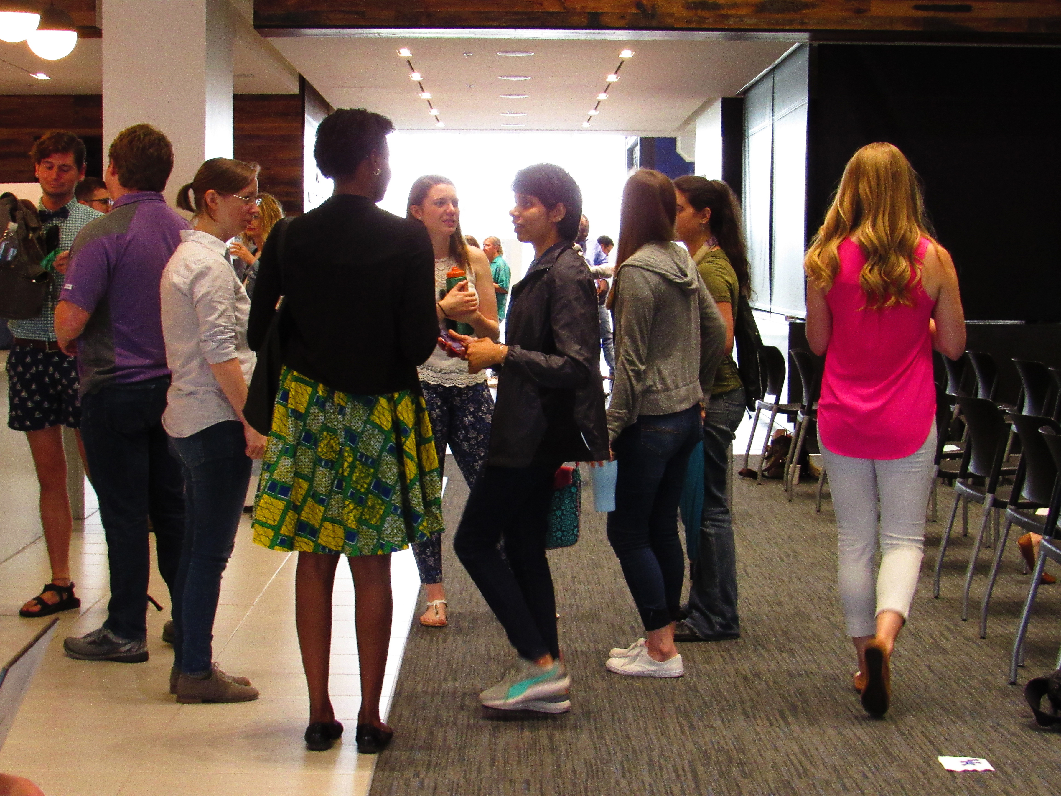 Students giving poster presentations.