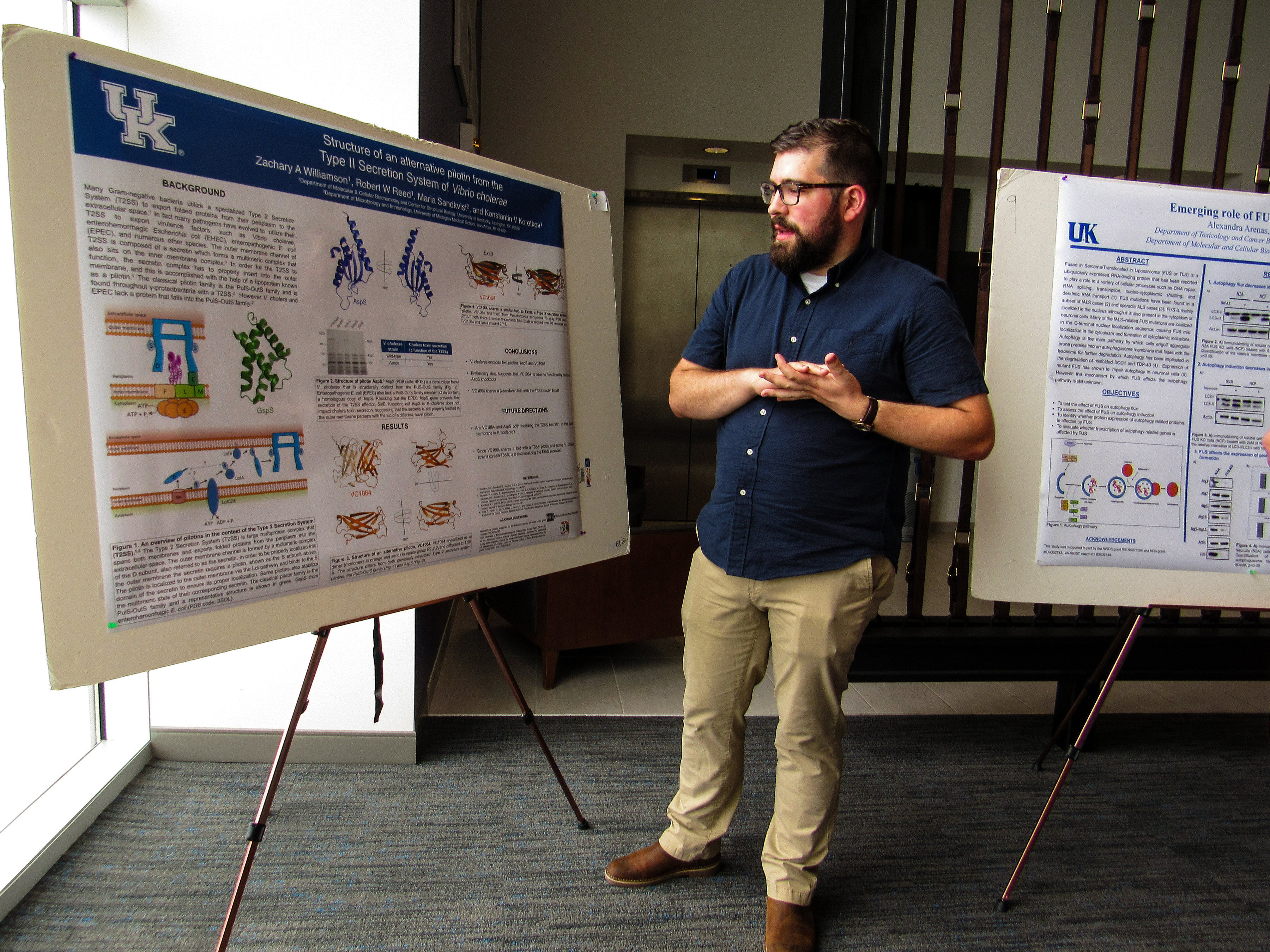 Biochemistry student presenting a poster.