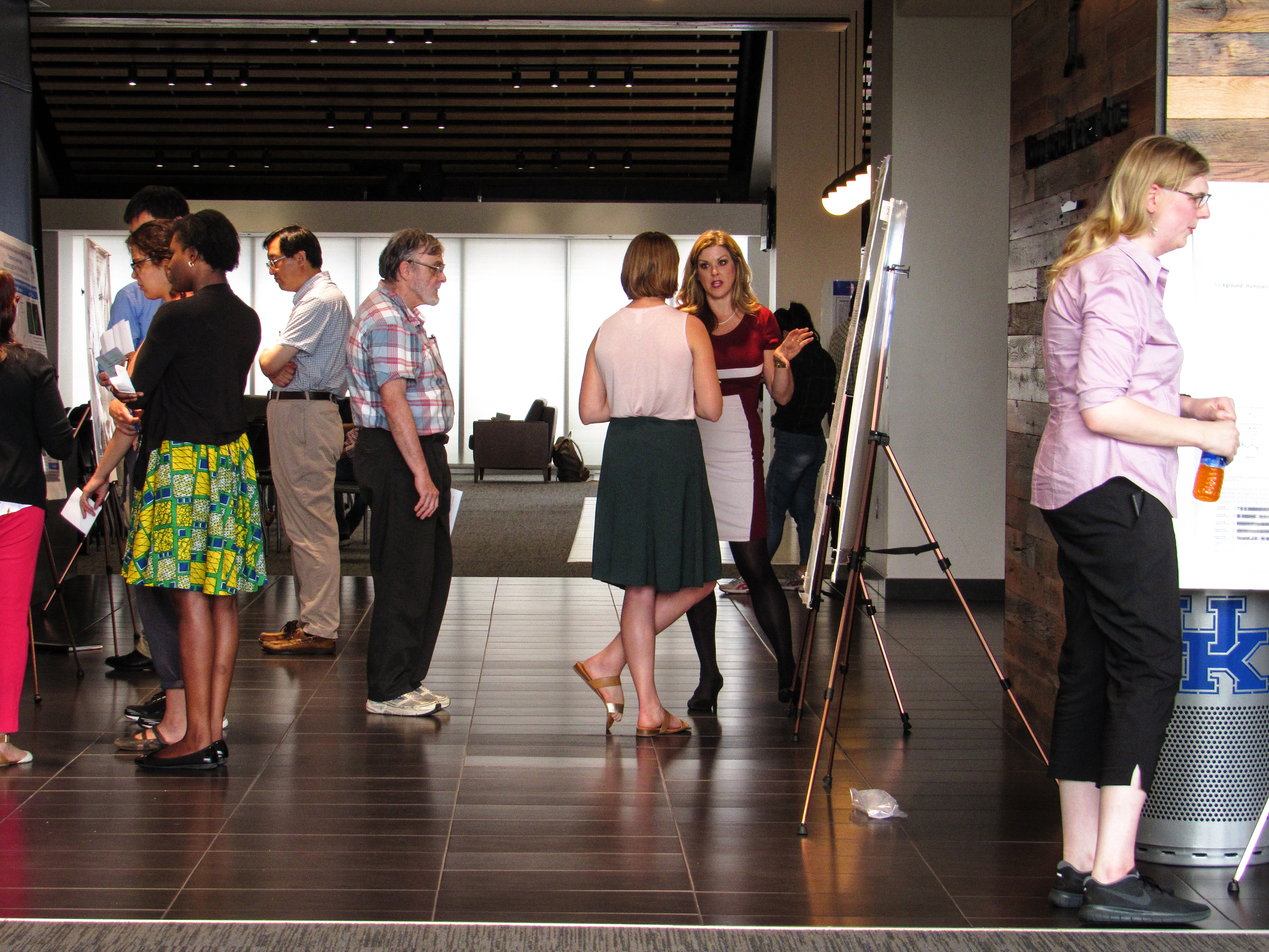 Biochemistry students at conference, presenting posters.