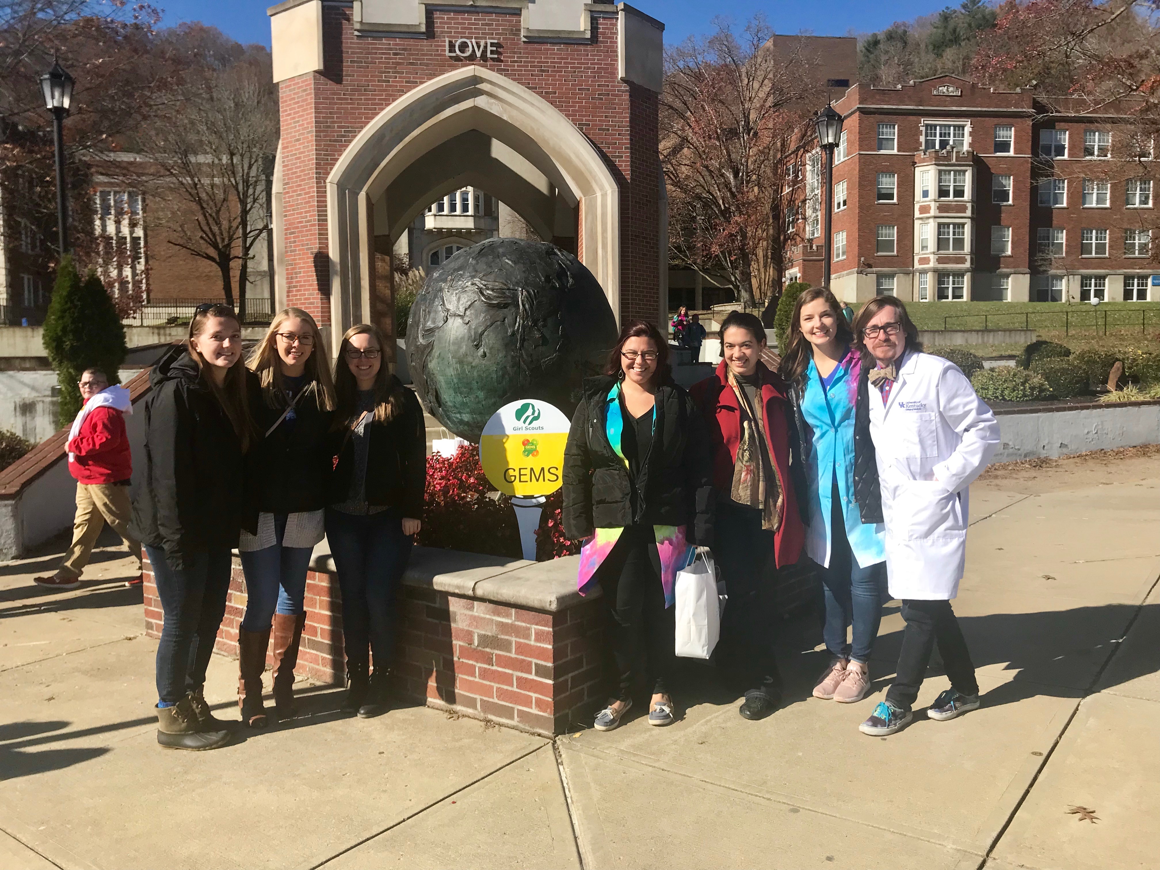 Biochemistry students in front of arch.