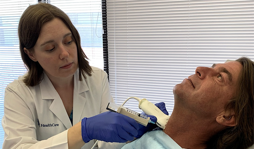 Dr. Richards performing an ultrasound-guided fine needle aspiration of a neck lesion.