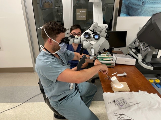 Dr. Pappal navigates a flexible bronchoscopy simulation for foreign body removal under the tutelage of Dr. Azbell.