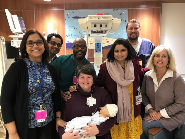 Second Year Fellows participating in Difficult Conversations in the NICU. November 2018  L to R: Dr. Aparna Patra, Dr. Prasad Bhandary, Dr. Mark Stephens, Sarah Steen (seated), Dr. Rucha Shukla, Dr. Brian Moore, Beth Whitlock (seated)