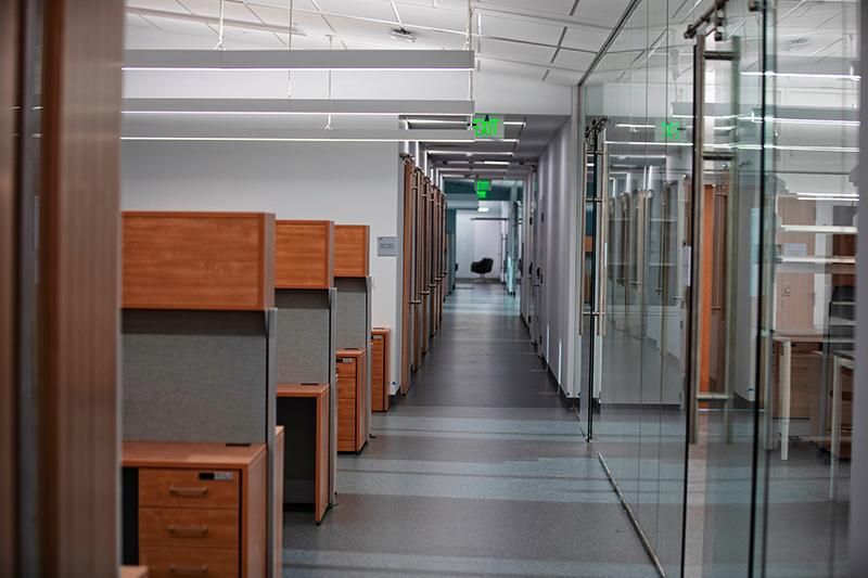 multiple cubicles line a hallway