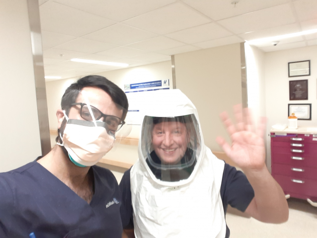 Drs. Maher Ajour and Peter Giannone prepare for a COVID-19 positive delivery.