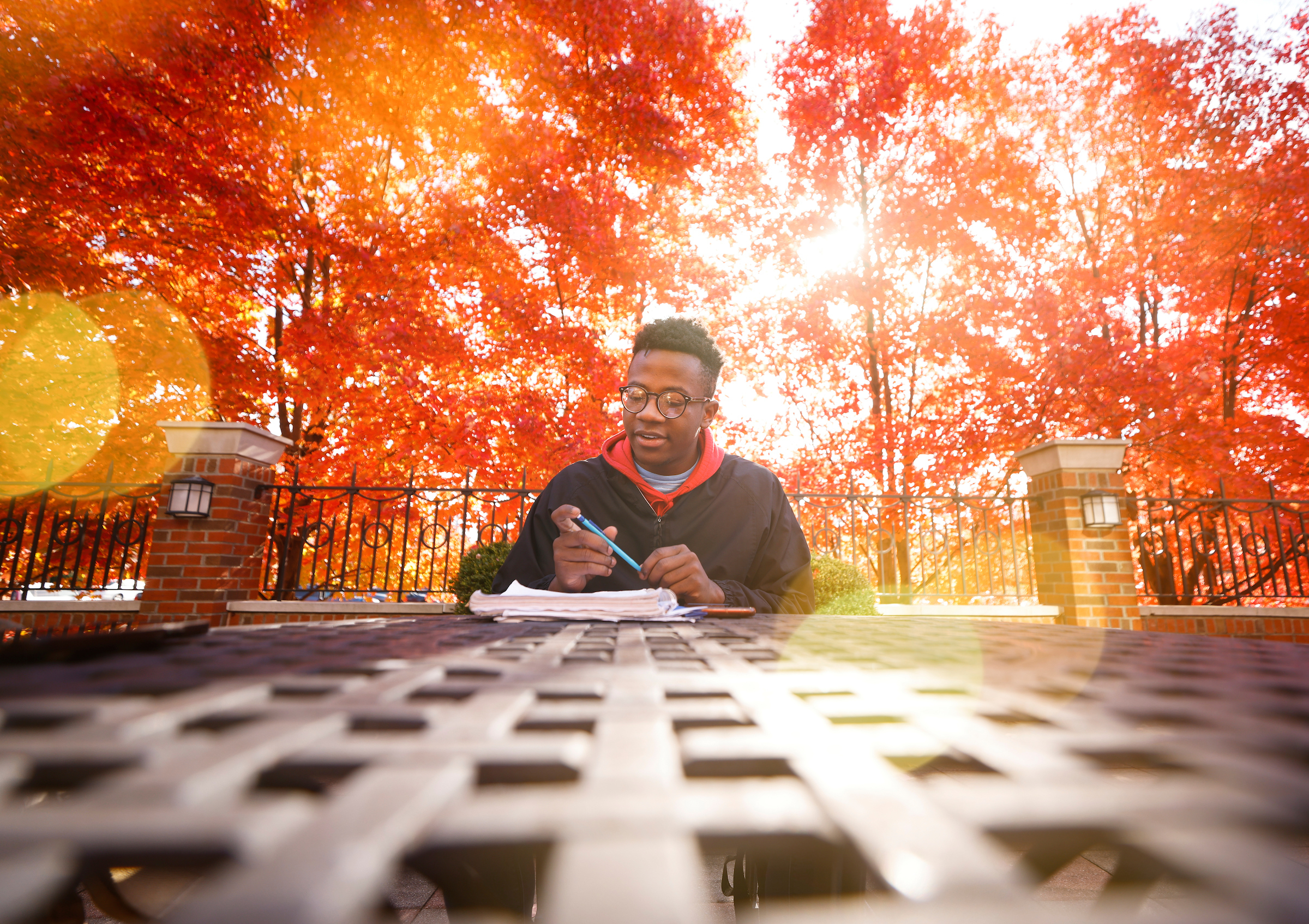 A student enjoying a Fall day