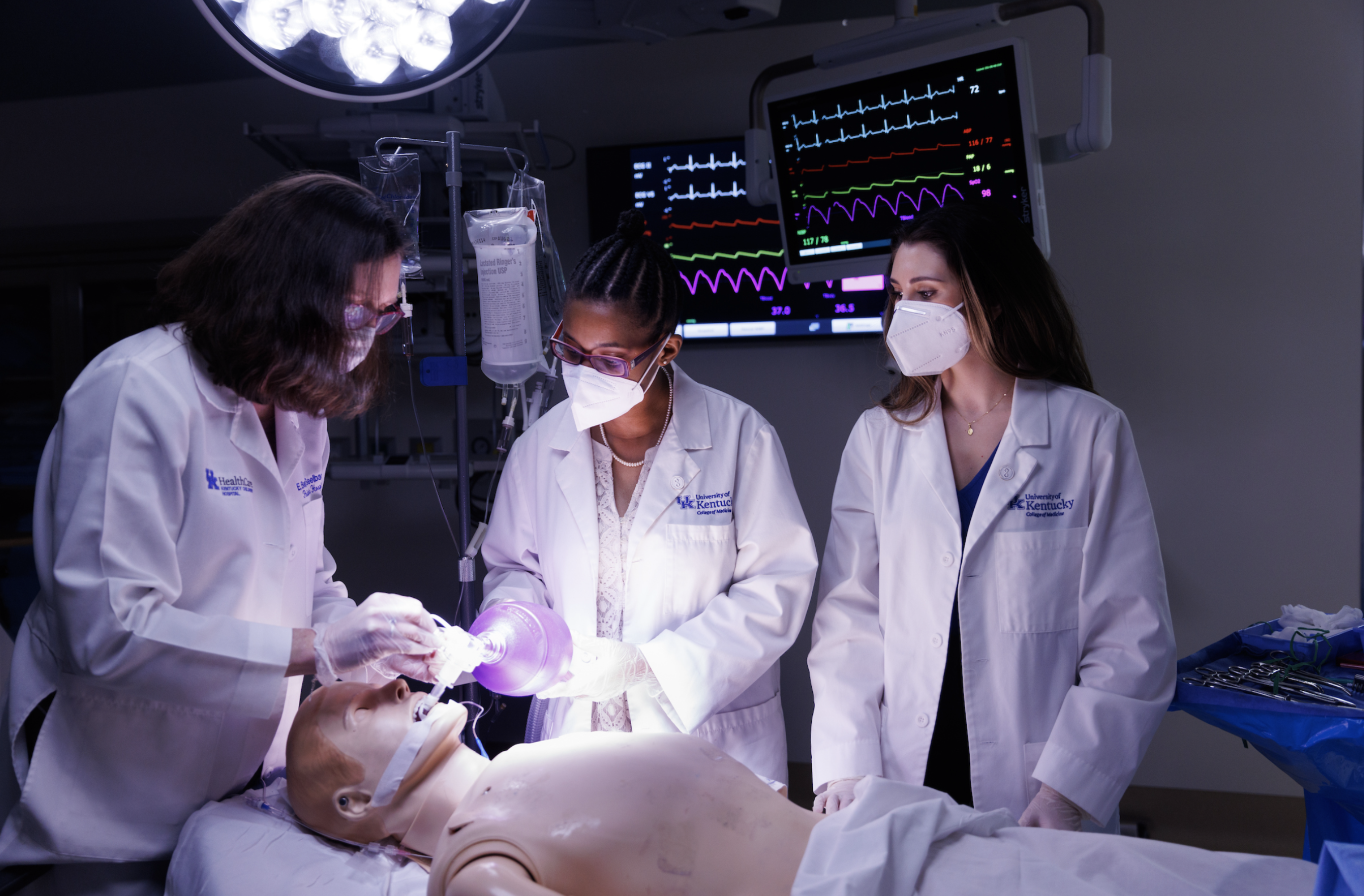 Faculty and students in a simulated operation