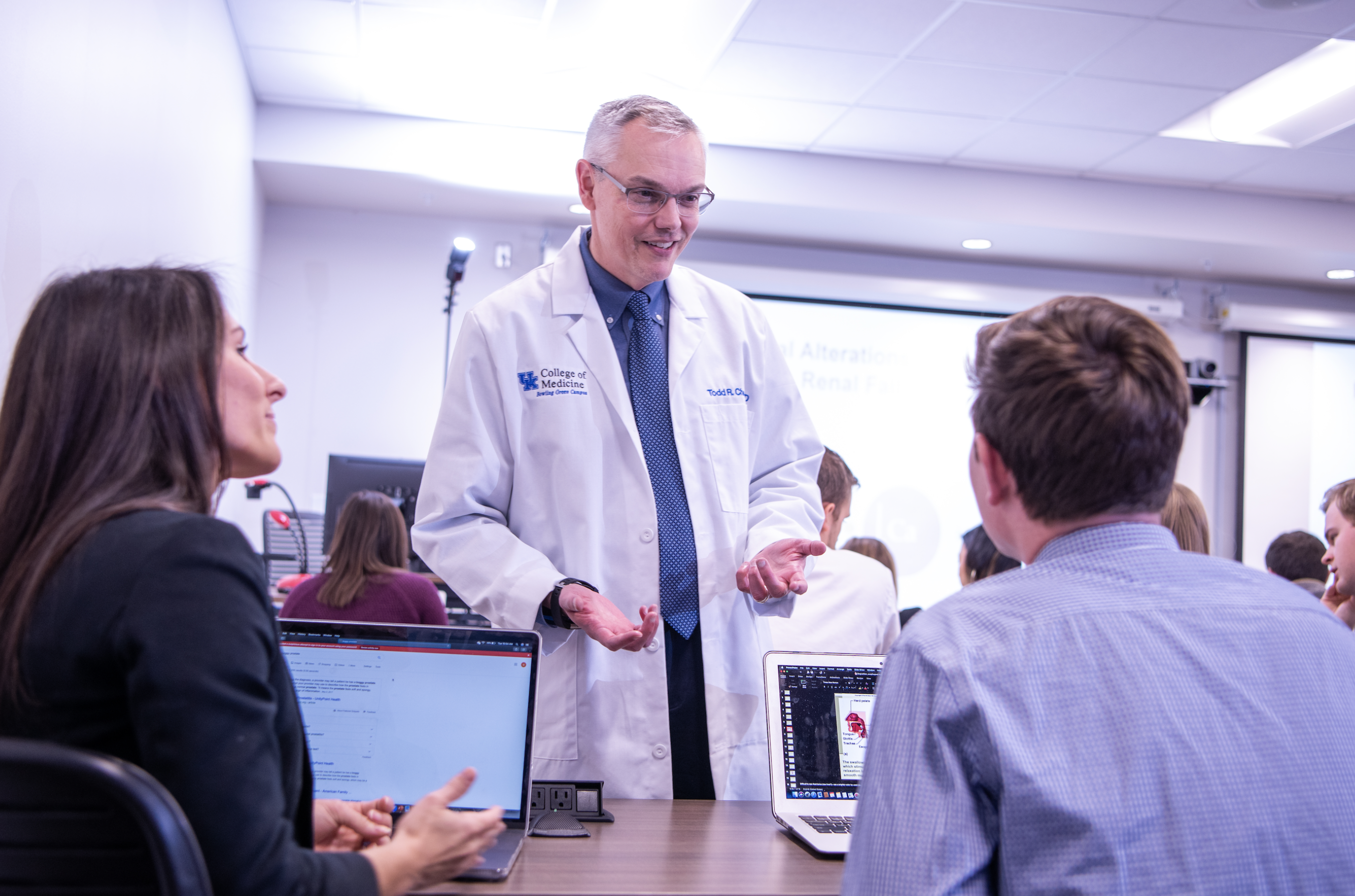 campus dean and faculty member teaching in a classroom