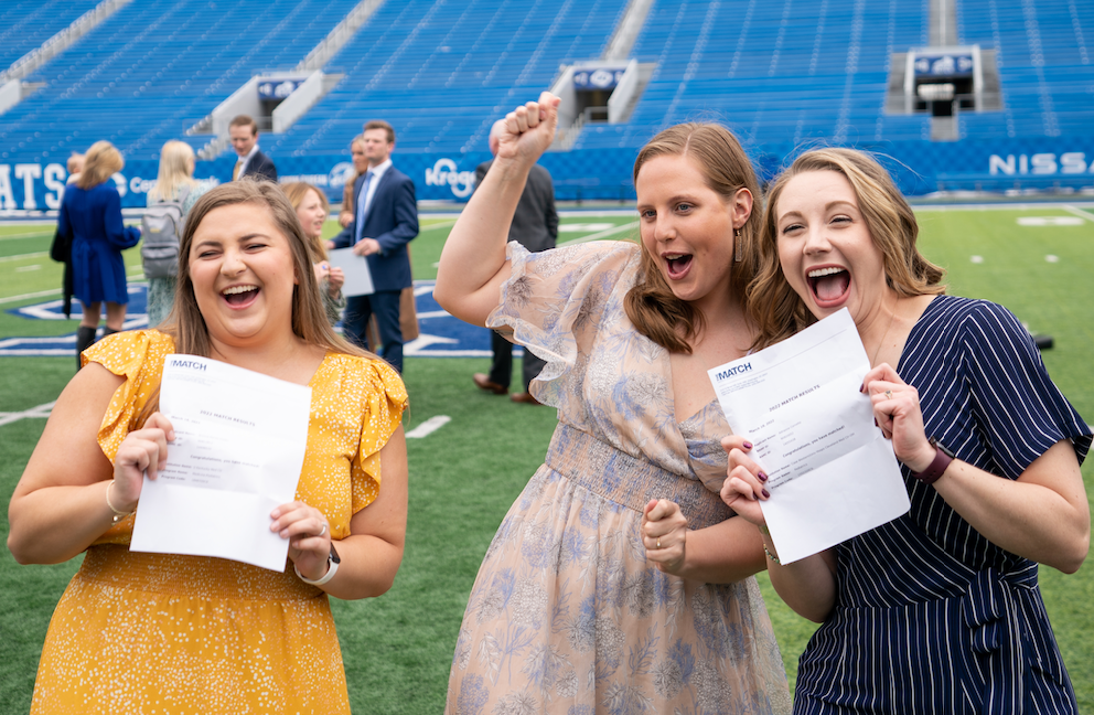 students celebrating as they open their match letters