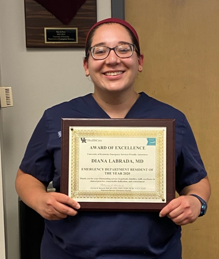 Dr. Labrada holding 'Emergency Department Resident of the Year' certificate.
