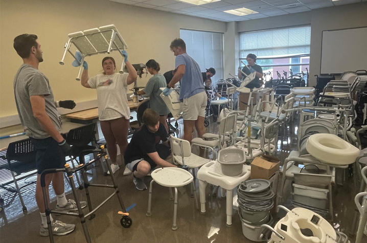 UK physical therapy students work to clean and assess donated medical equipment. The equipment is then refurbished and given to those in need.