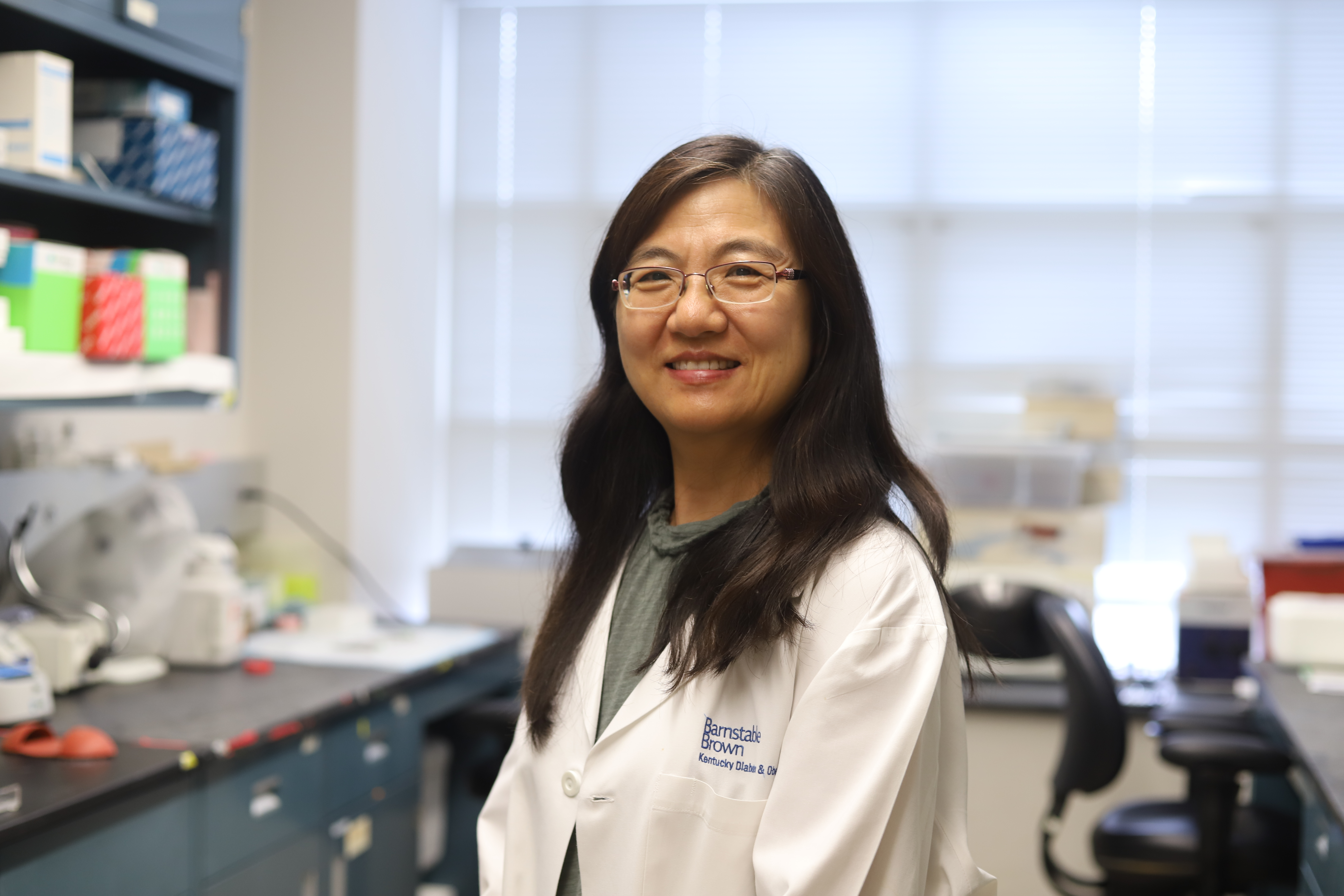 Shuxia Wang standing in her lab 