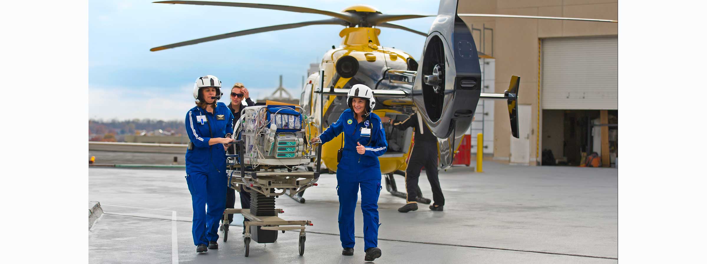 3 ladies and a helicopter on a patient transport