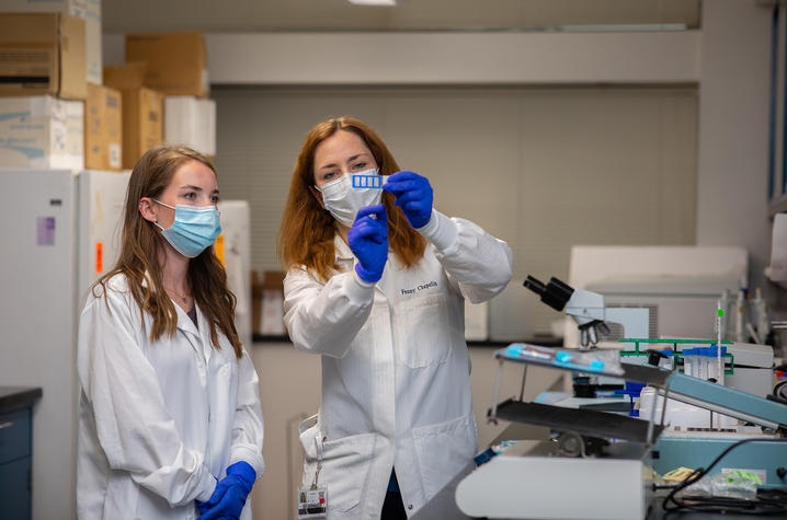 Fanny Chapelin (right), PhD with student in the lab