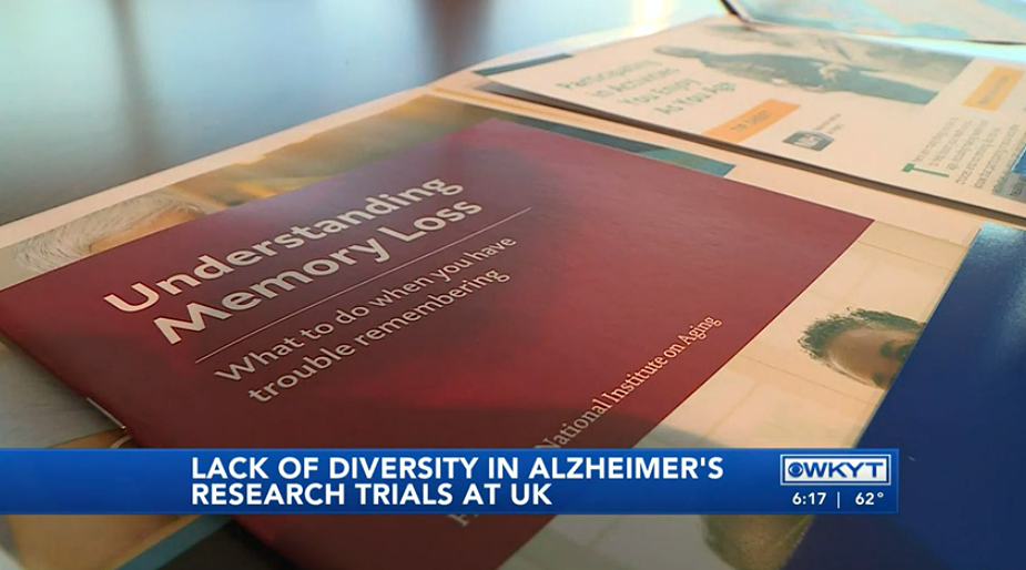 Close up of SBCoA materials: "Understanding Memory Loss" on a spotlight video by WKYT: "Lack of Diversity in Alzheimer's Research Trials at UK