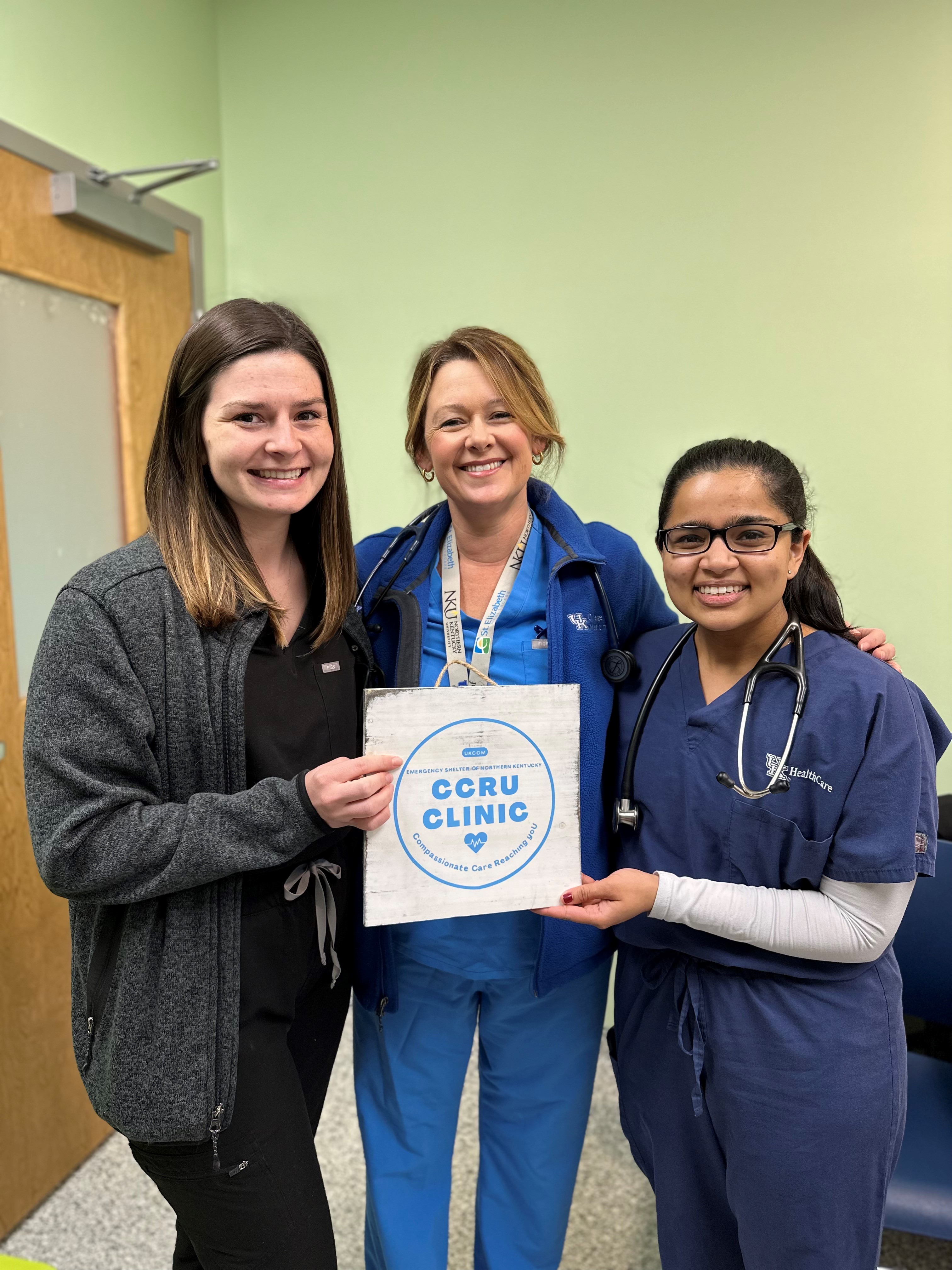 CCRU clinic student volunteers Christa Mattingly and Sonia Bhati pose with Dr. Holly Danneman