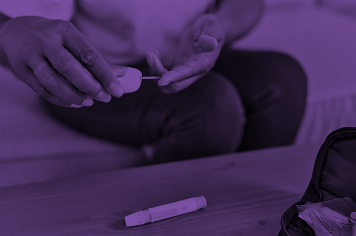 A purple filtered image of a diabetic person checking their blood sugar.