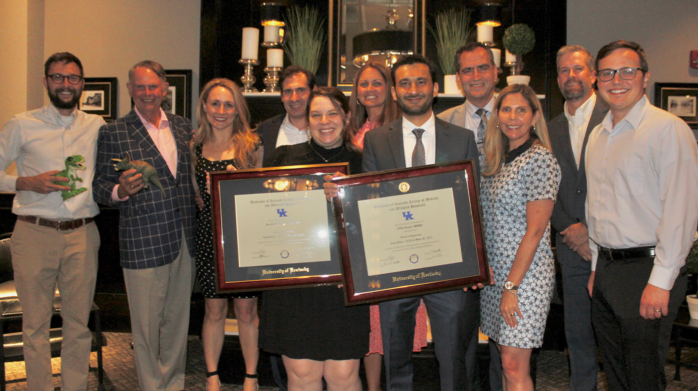 Kristin Hoover and Inu Fawa surrounded by the Nephrology faculty.