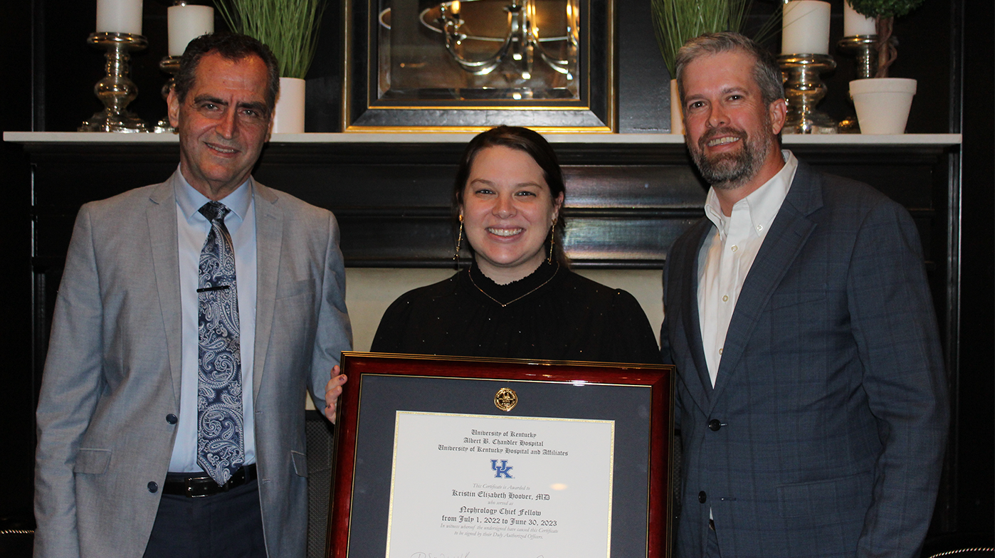 Dr. Sawaya, Kristin Hoover, and Dr. Webb standing with Kristin's degree