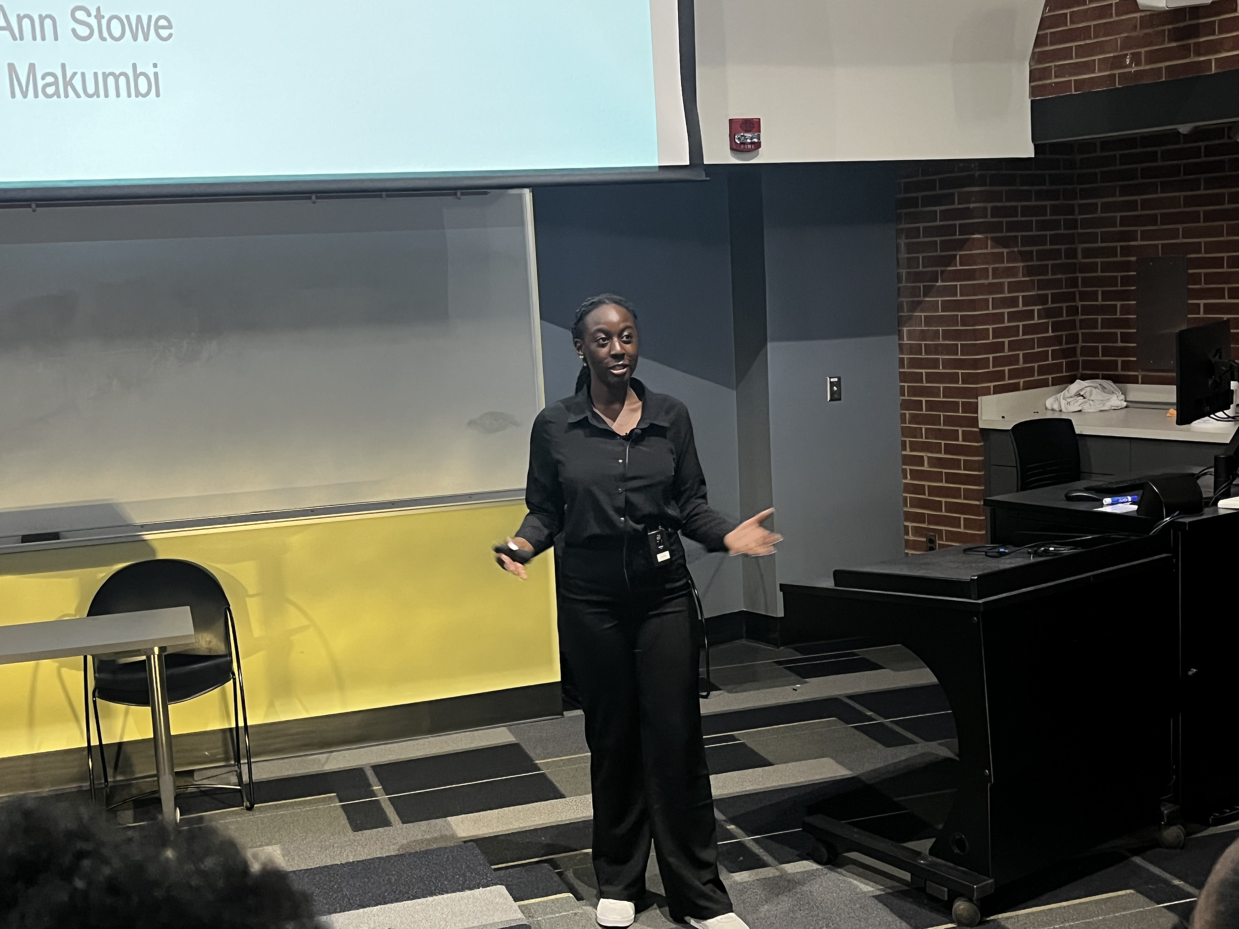 a photo of AARTS student Hopemarie Makumbi giving a presentation 