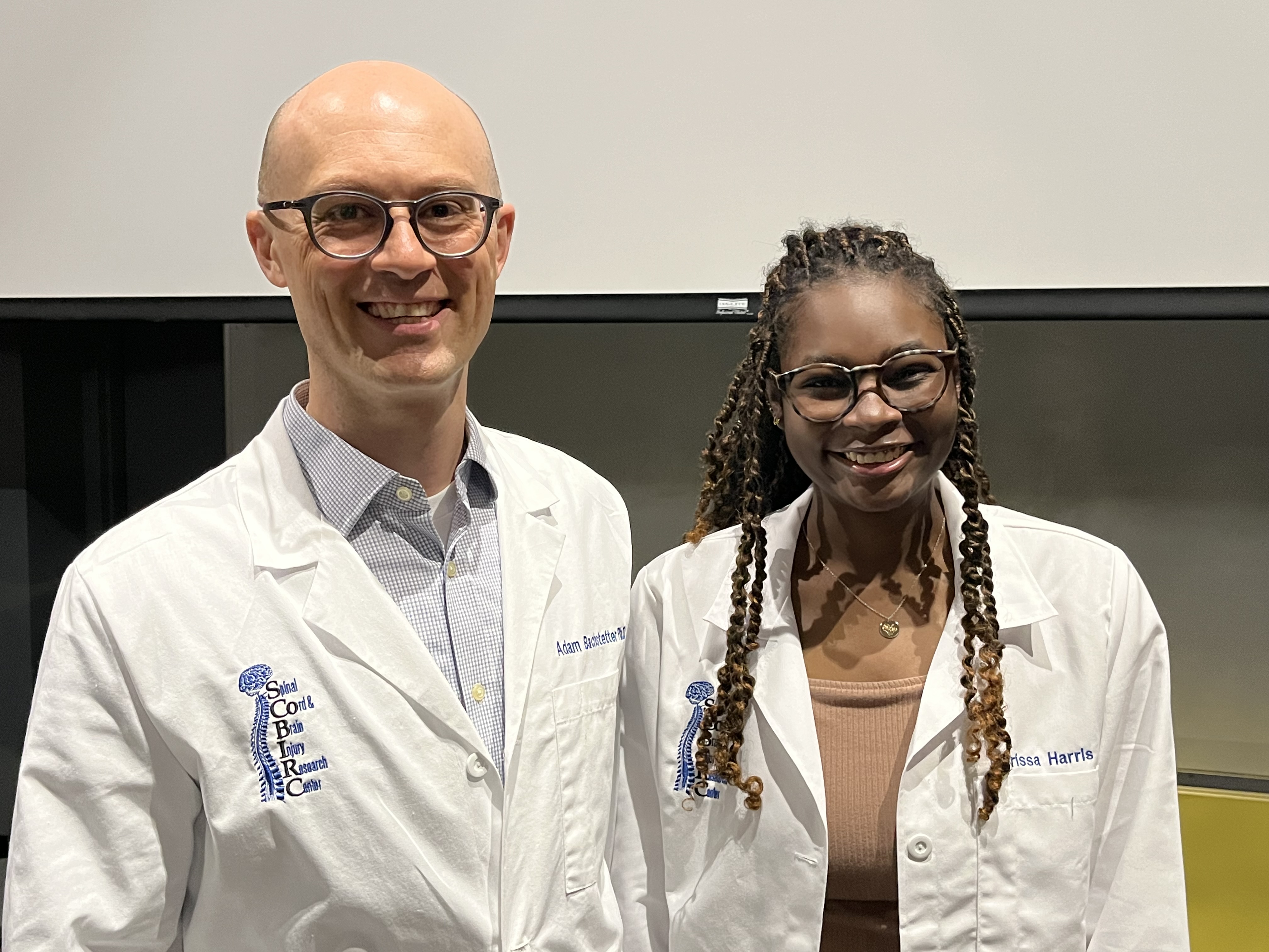 a photo of AARTS student Marissa Harris with mentor Dr. Adam Bachstetter 