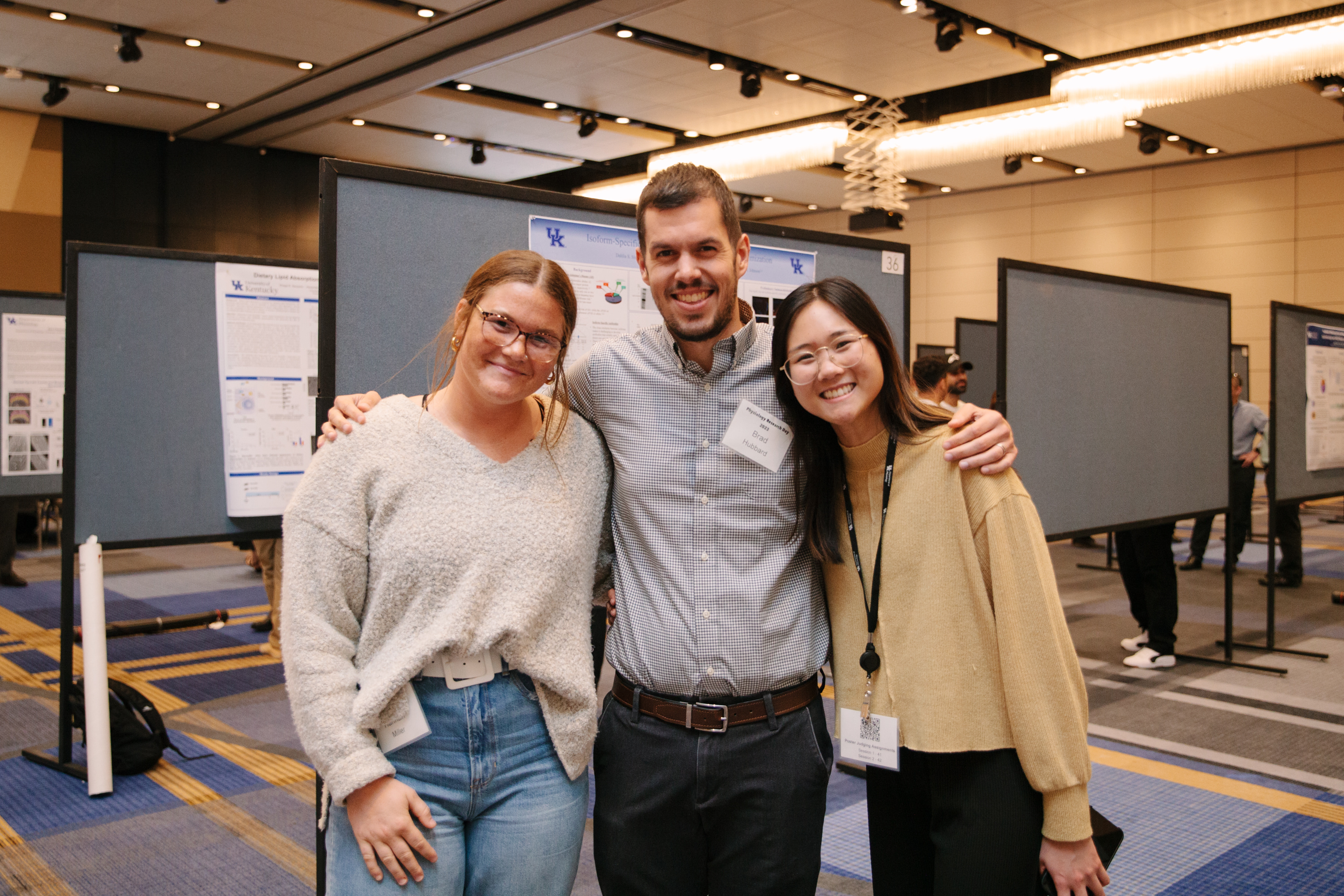 a photo of Hannah Williams, Dr. Brad Hubbard, and Sarah Tran at Physiology Research Day 