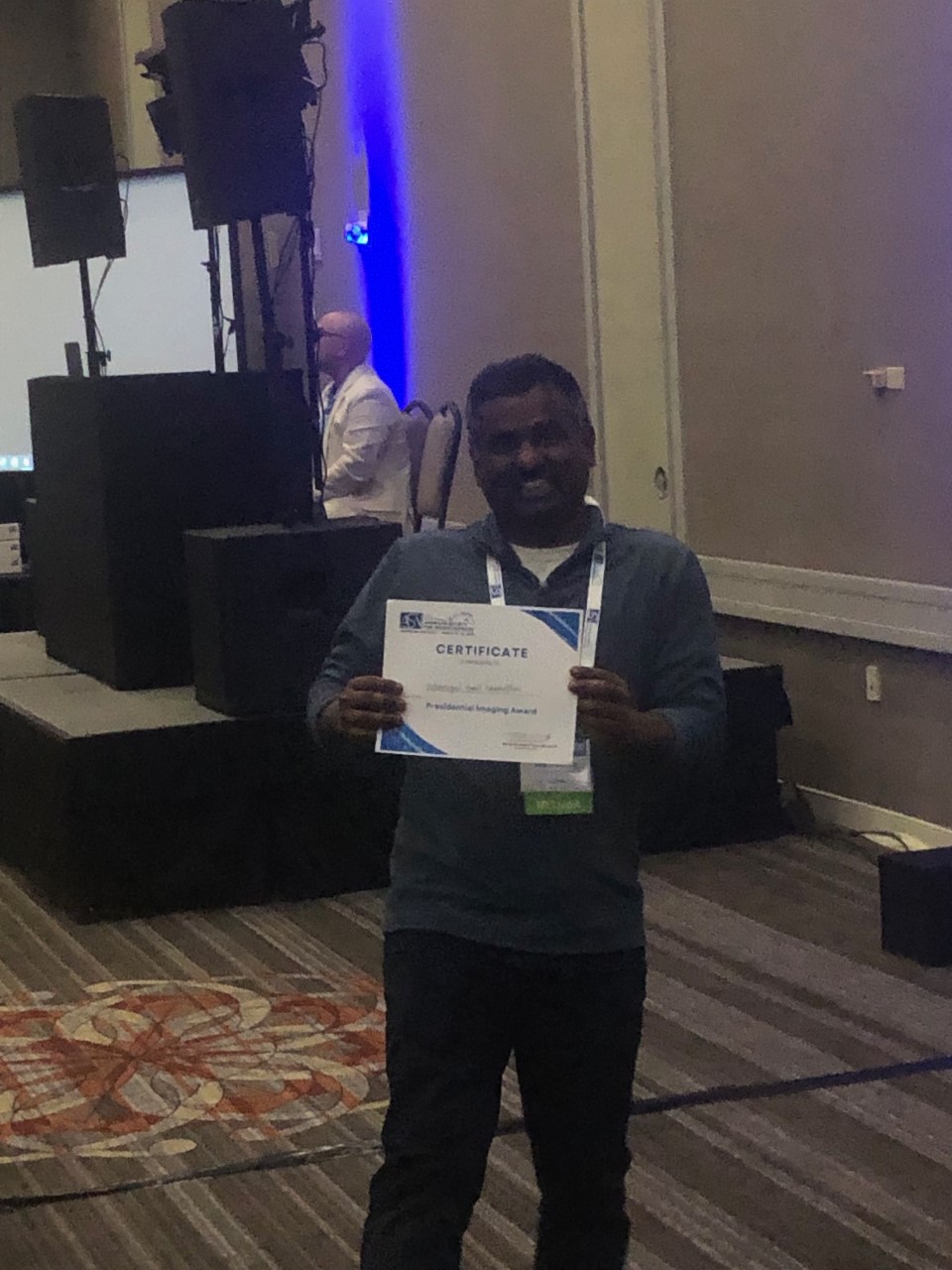 A photo of Velu, a member of Brad Hubbard's lab, at ASN conference 