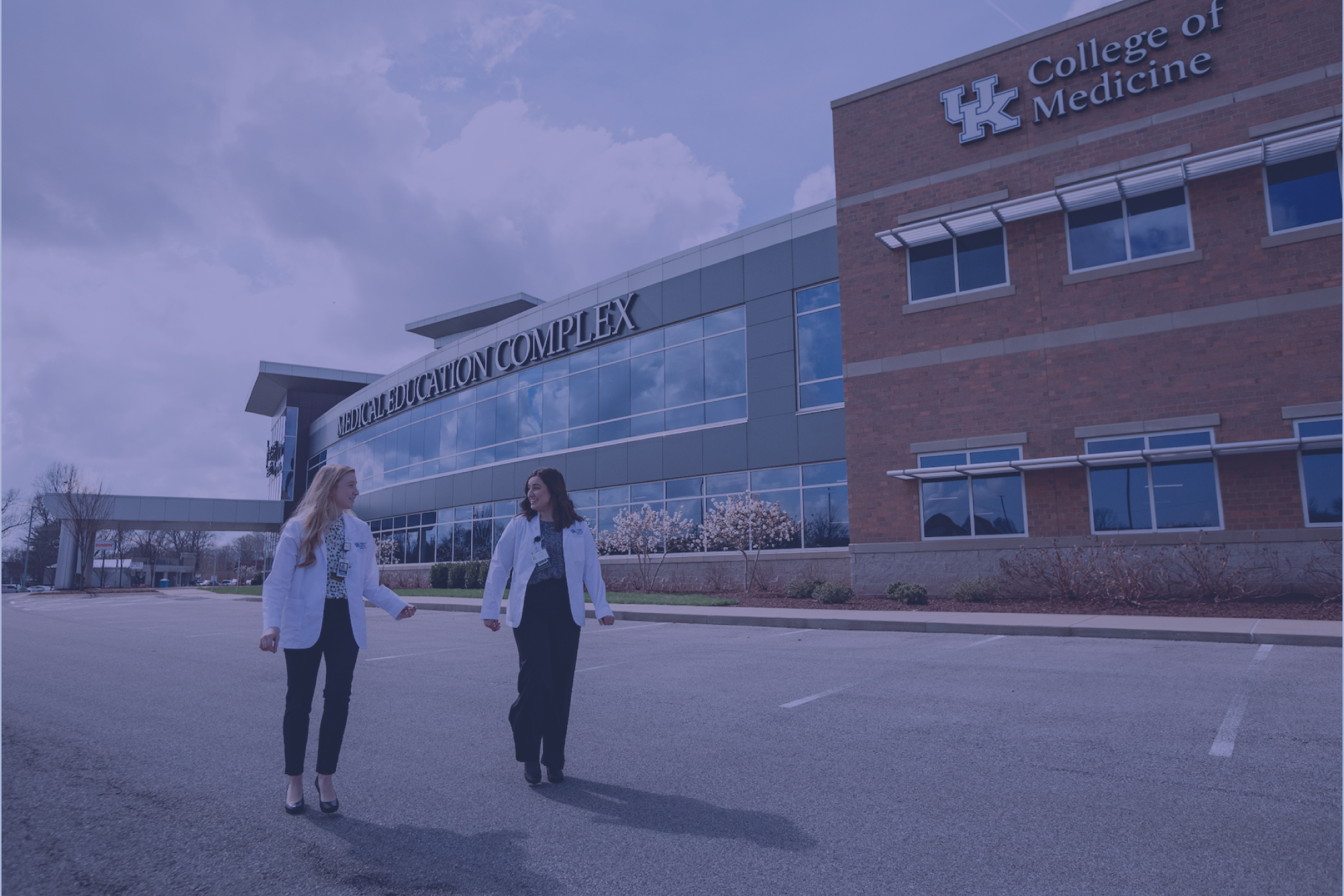 two medical students walking outside of the bowling green facility