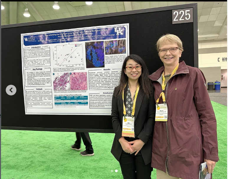 Dr. Jing Di and Dr. Therese Bocklage receiving an award