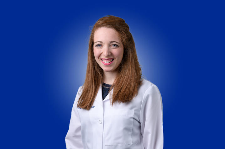 Brittany Levy, MD in her white coat.