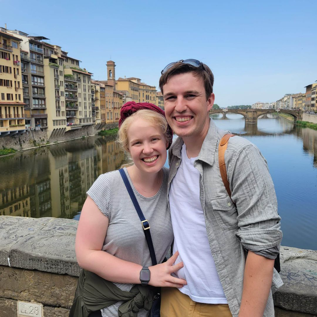 Jerod Crockett and his girlfriend standing on a bridge in a European country.