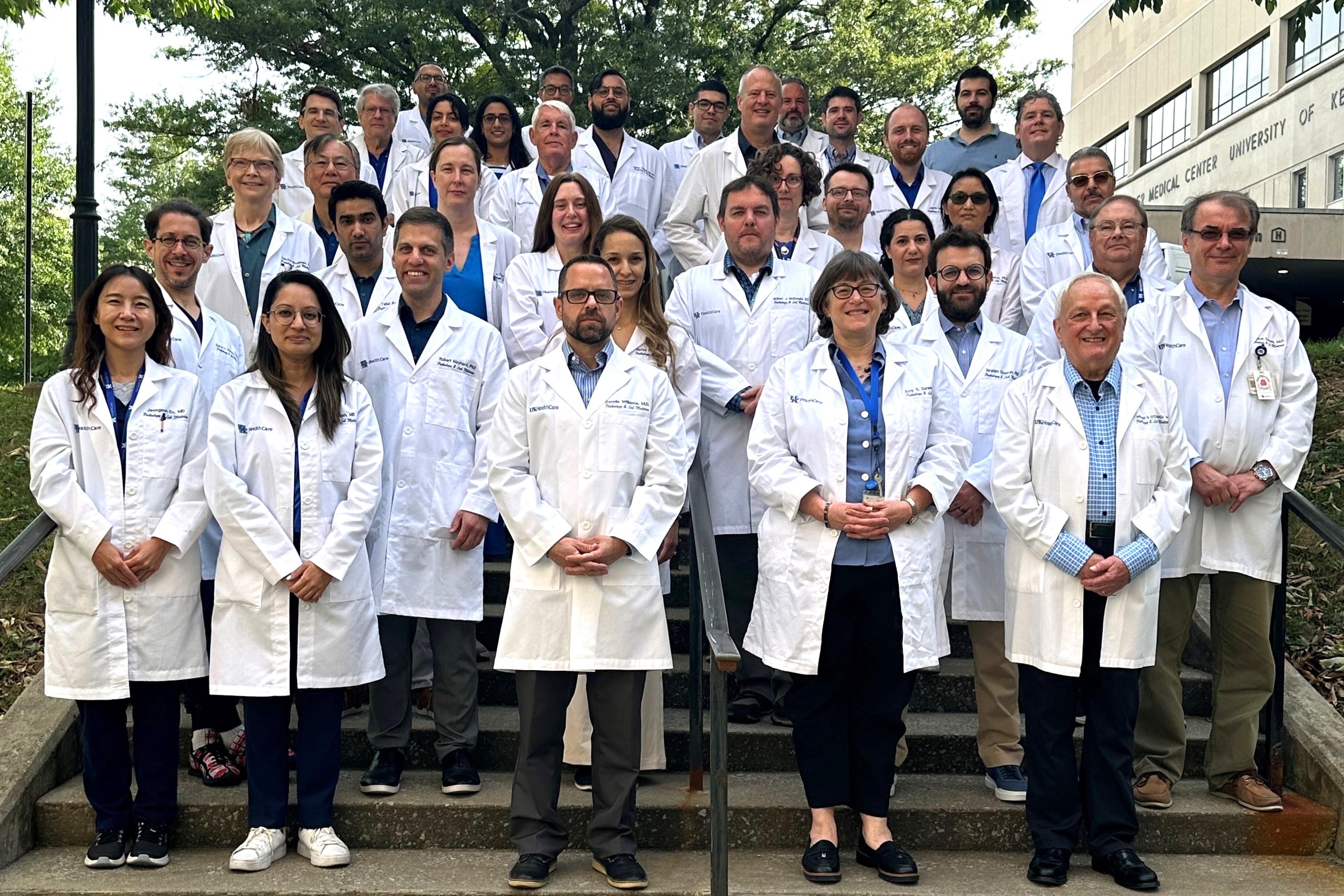 Faculty and residents in their white coats