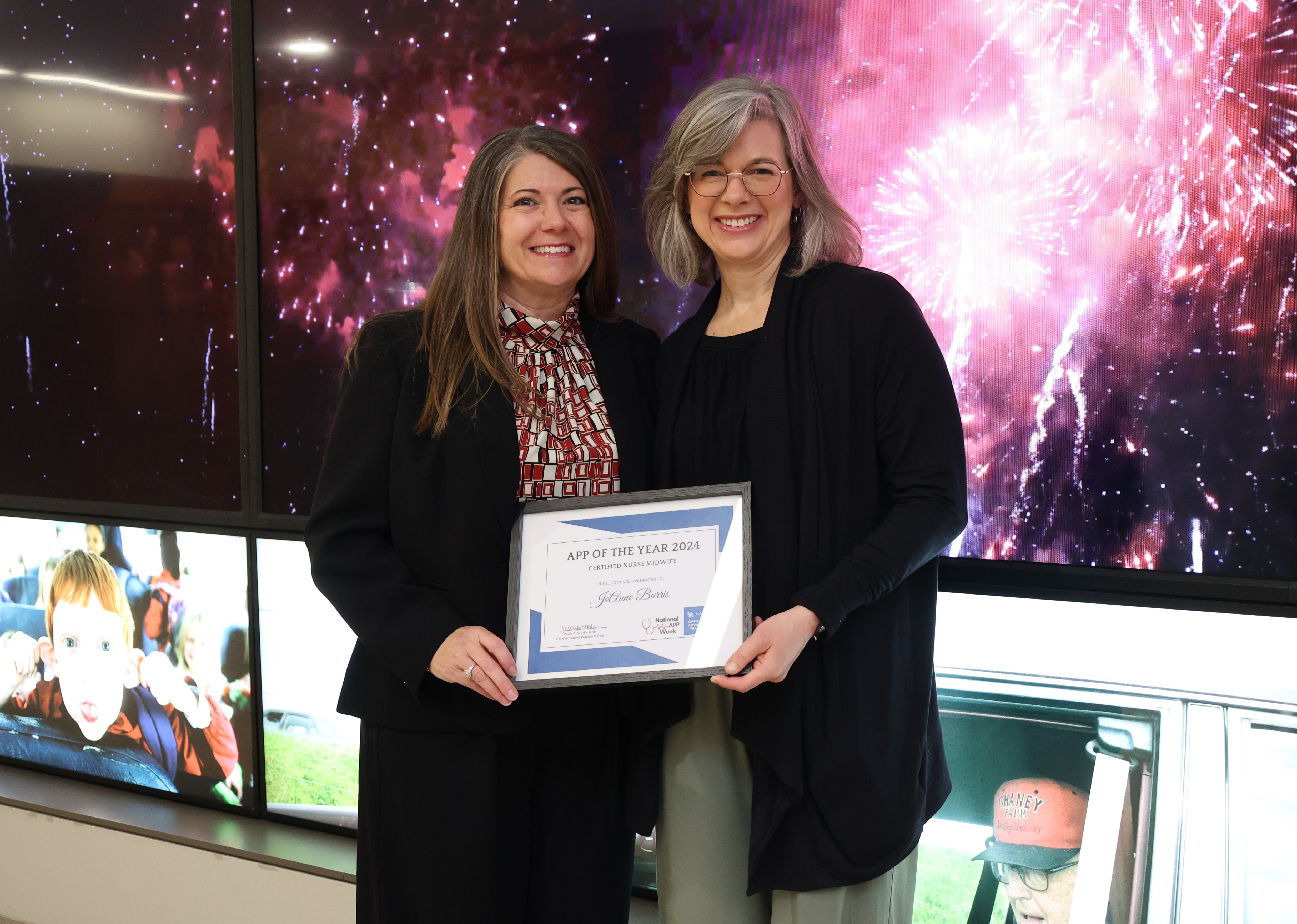 Paula works, DNP, Chief Advanced Practice Officer, presents CNM of the year award to JoAnne Burris, CNM in the OB-GYN department at UK