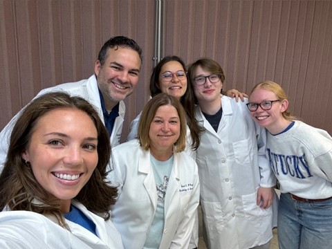 Mary Ella Hamm, Christopher Radka, Sarah D'Orazio, Svetlana Zamakhaeva, Robert Neff, and Eileen Bunch pose for a picture.