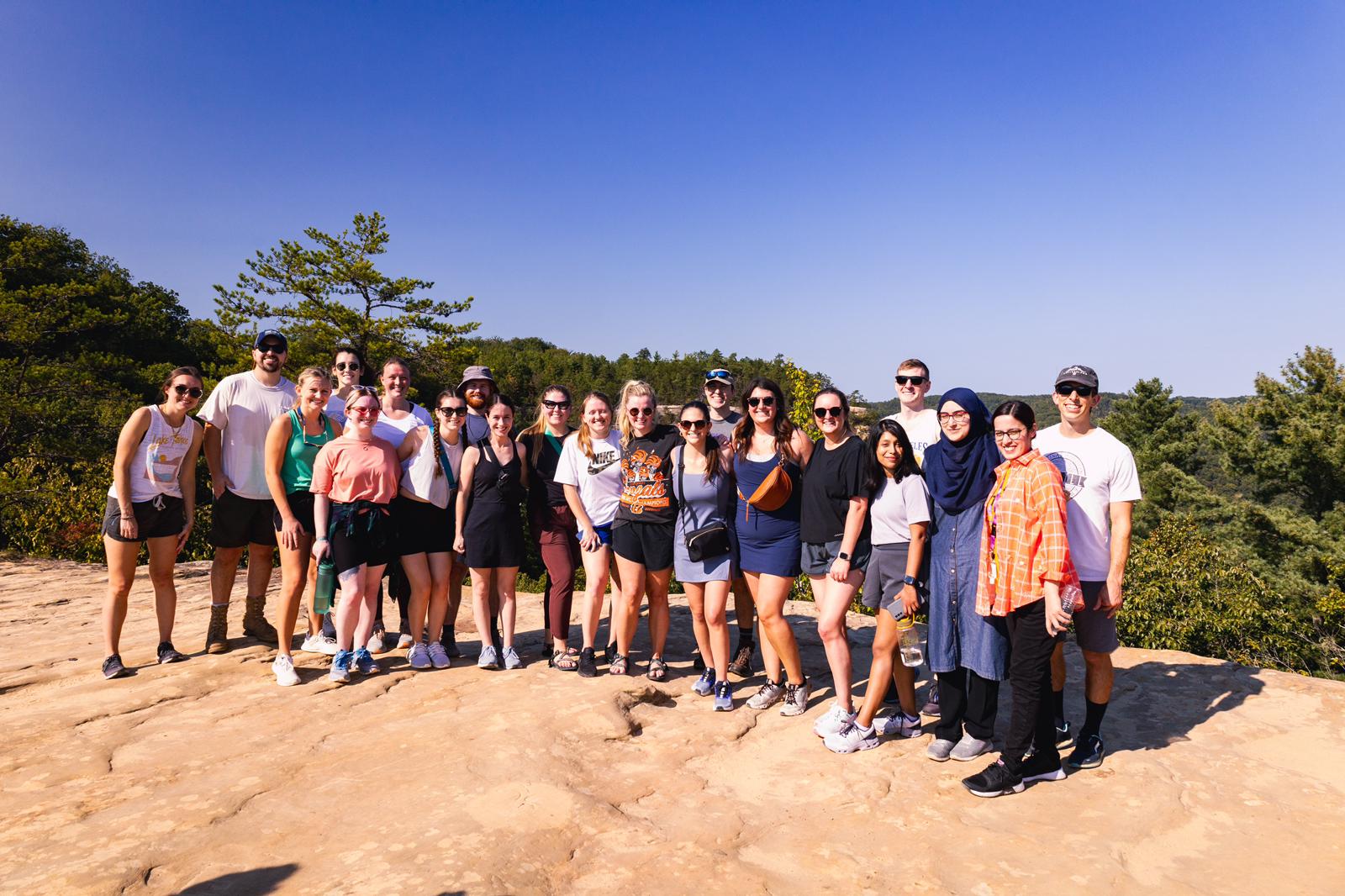 kentucky pediatric residents on a nature hike, prioritizing community and well-being.