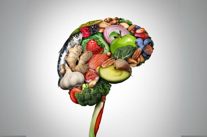 Several healthy foods layered together in the shape of the human brain.