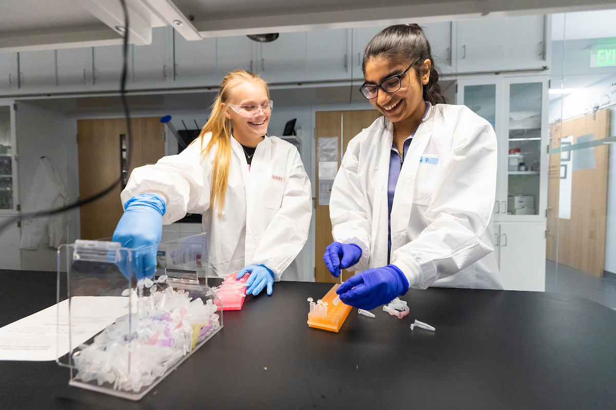 two students in a research lab