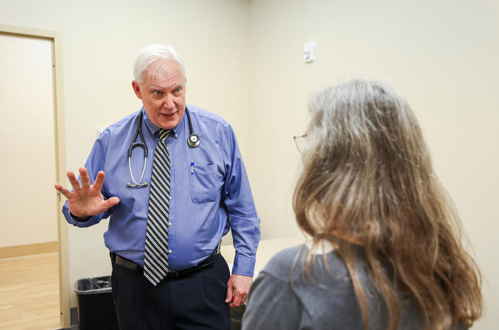 Greg Jicha, MD, PhD, director of clinical trials at UK’s Sanders-Brown Center on Aging, conducts an exam. 