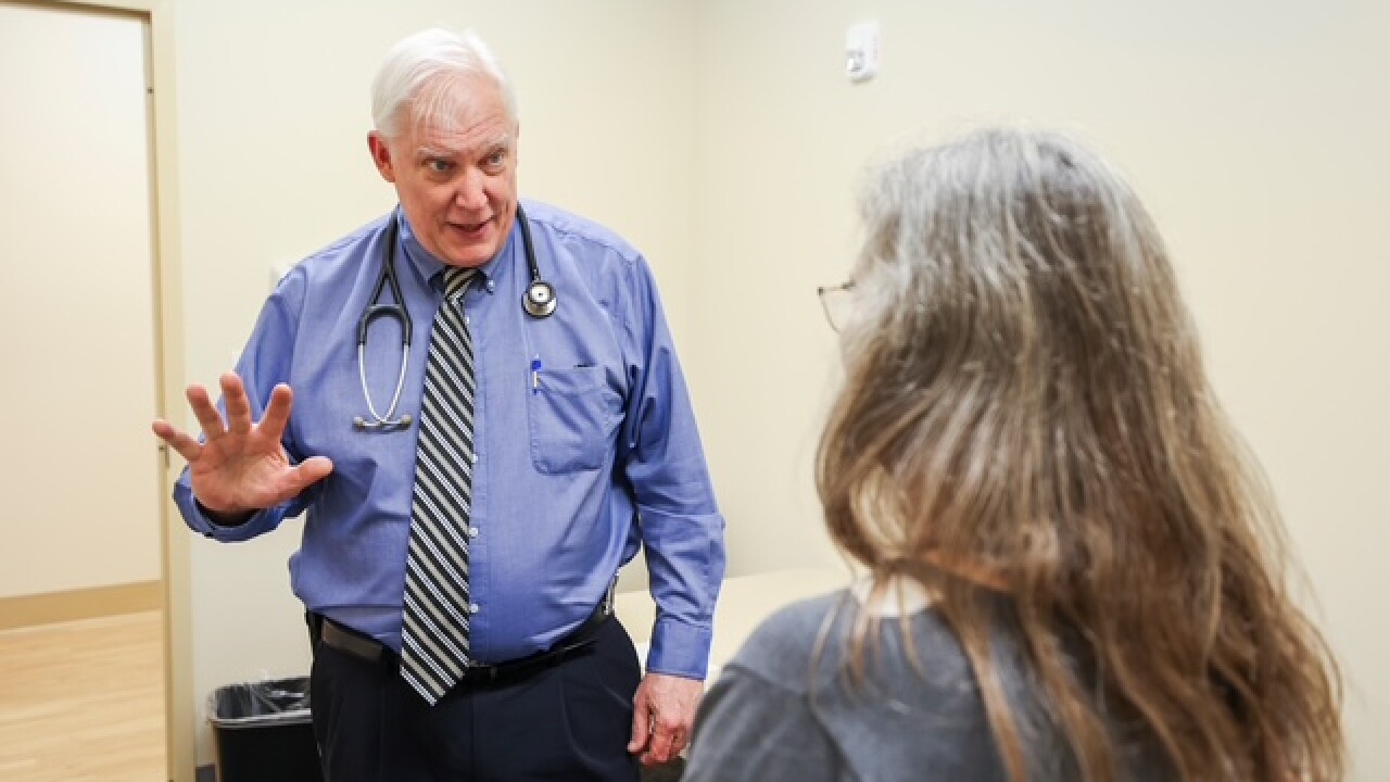 Dr. Greg Jicha and Dr. Pinar Coskun conduct an exam on February 15, 2024.