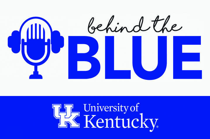 Behind the blue logo, a microphone seeming to wear a set of headphones, beside the text "behind the blue" University of Kentucky