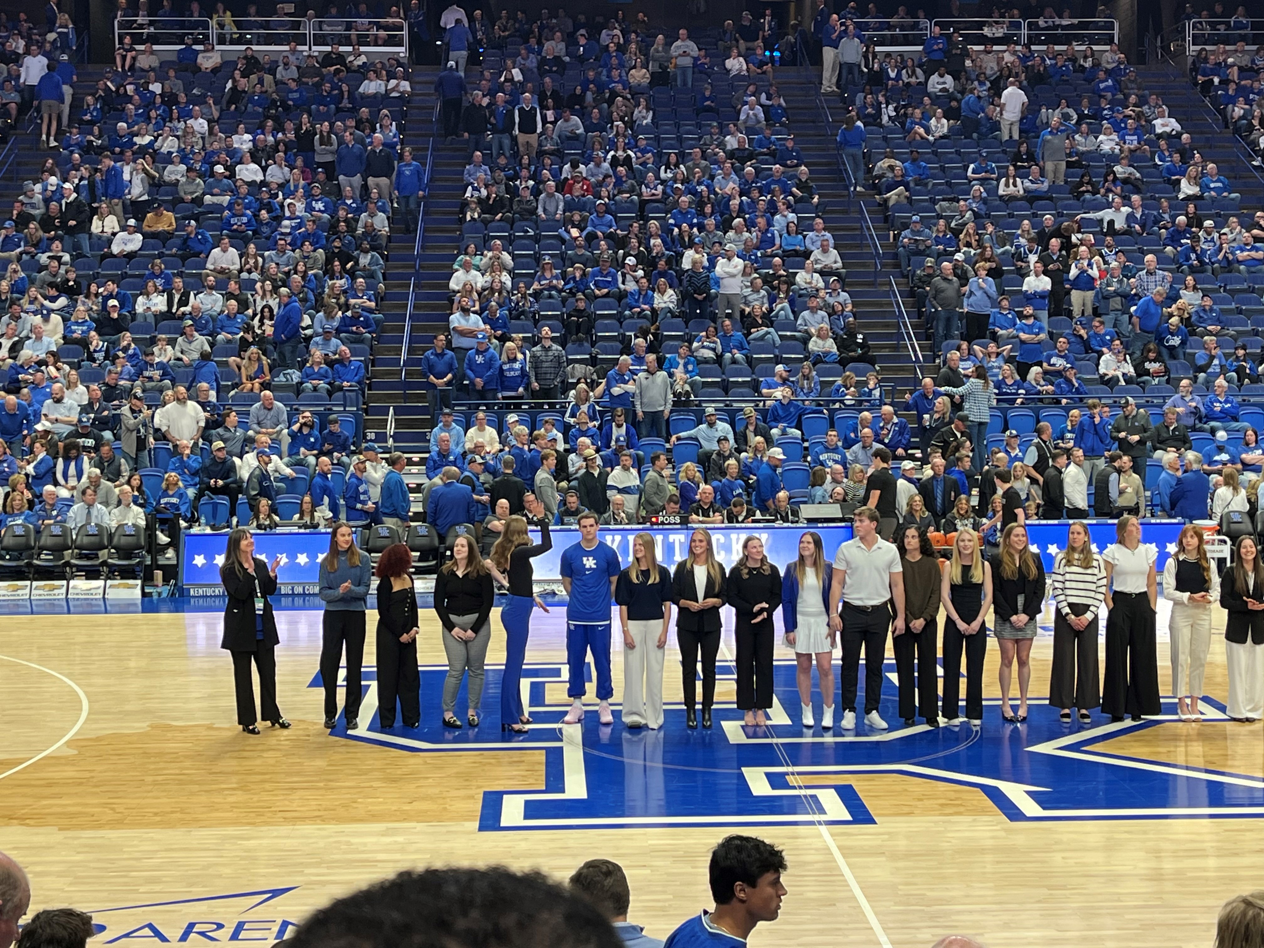 Ham inductees on the floor of Rupp arena, Caroline Benda is the second from the left