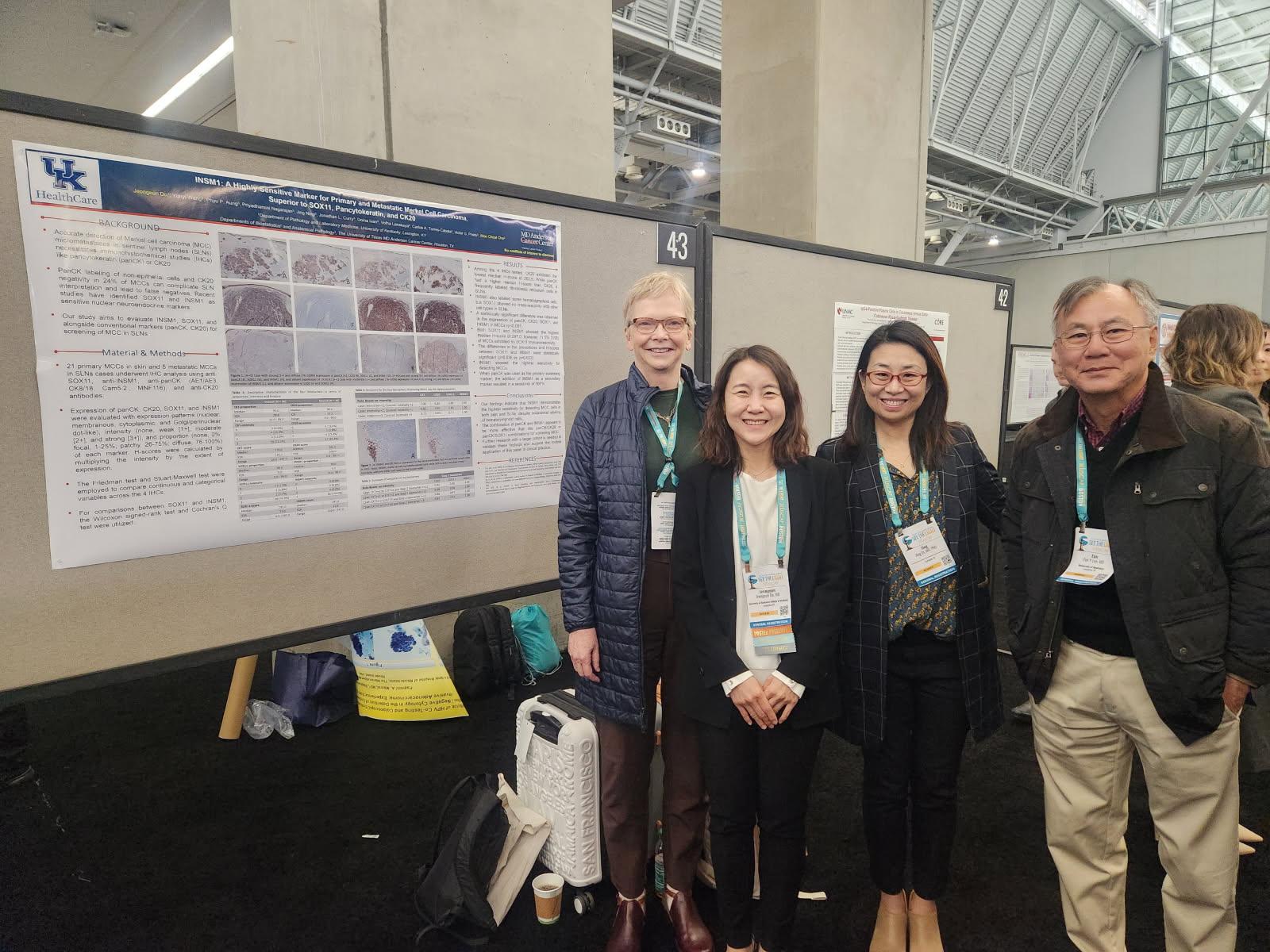 Drs. Therese Bocklage, Jeongeun Do, Jing Di, and Eun Lee's poster presentation.