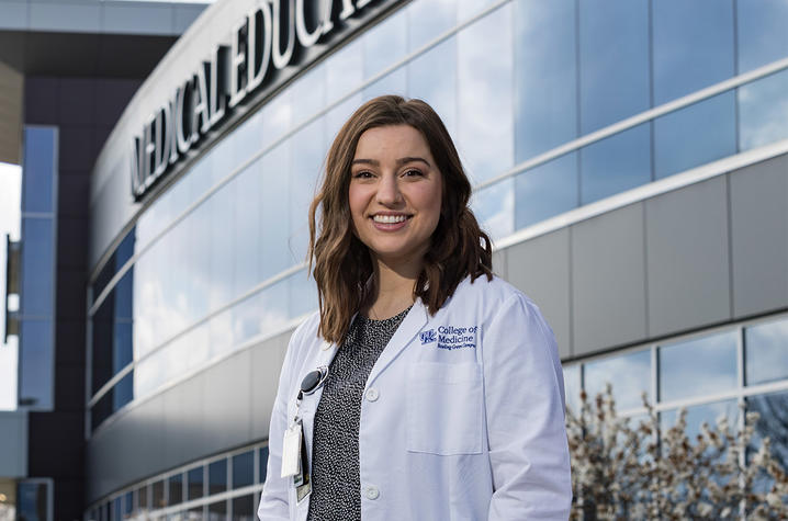 Anna Cox standing in front of the Medical Education building on Bowling Green's campus.