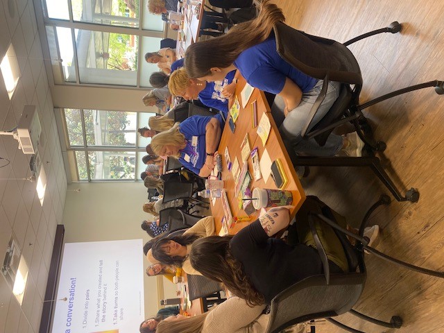 Gathered to color and tell stories at tables