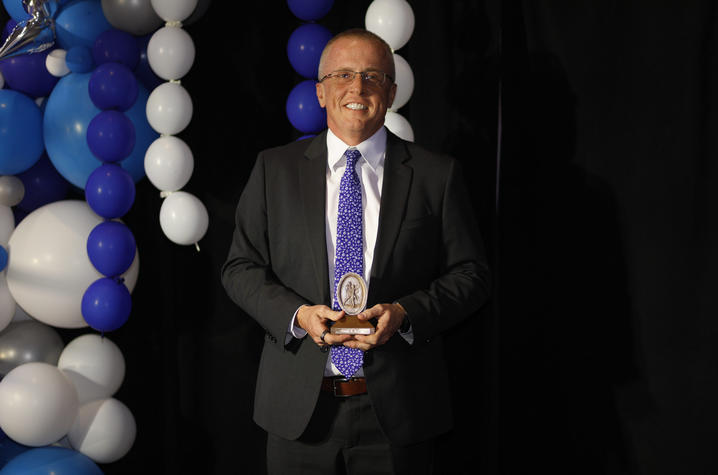 Dr. Scottie Day poses with award