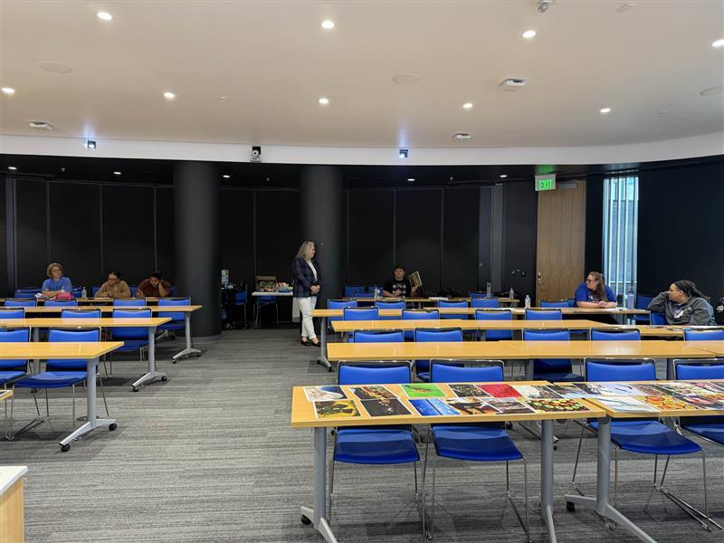 Tables with photos on top of them in a large room
